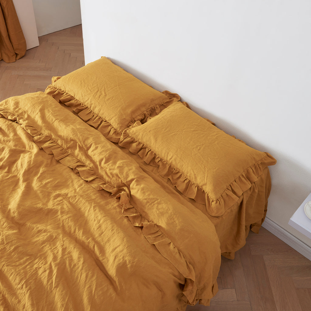 Mustard Yellow Linen Ruffle Hem Pillowcases on Bed