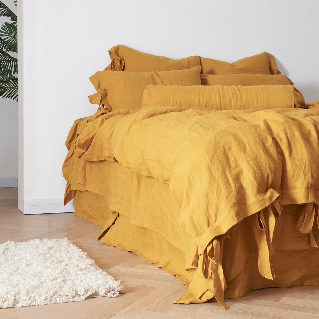 100% Linen Mustard Yellow Duvet Cover with Bow Ties on Bed