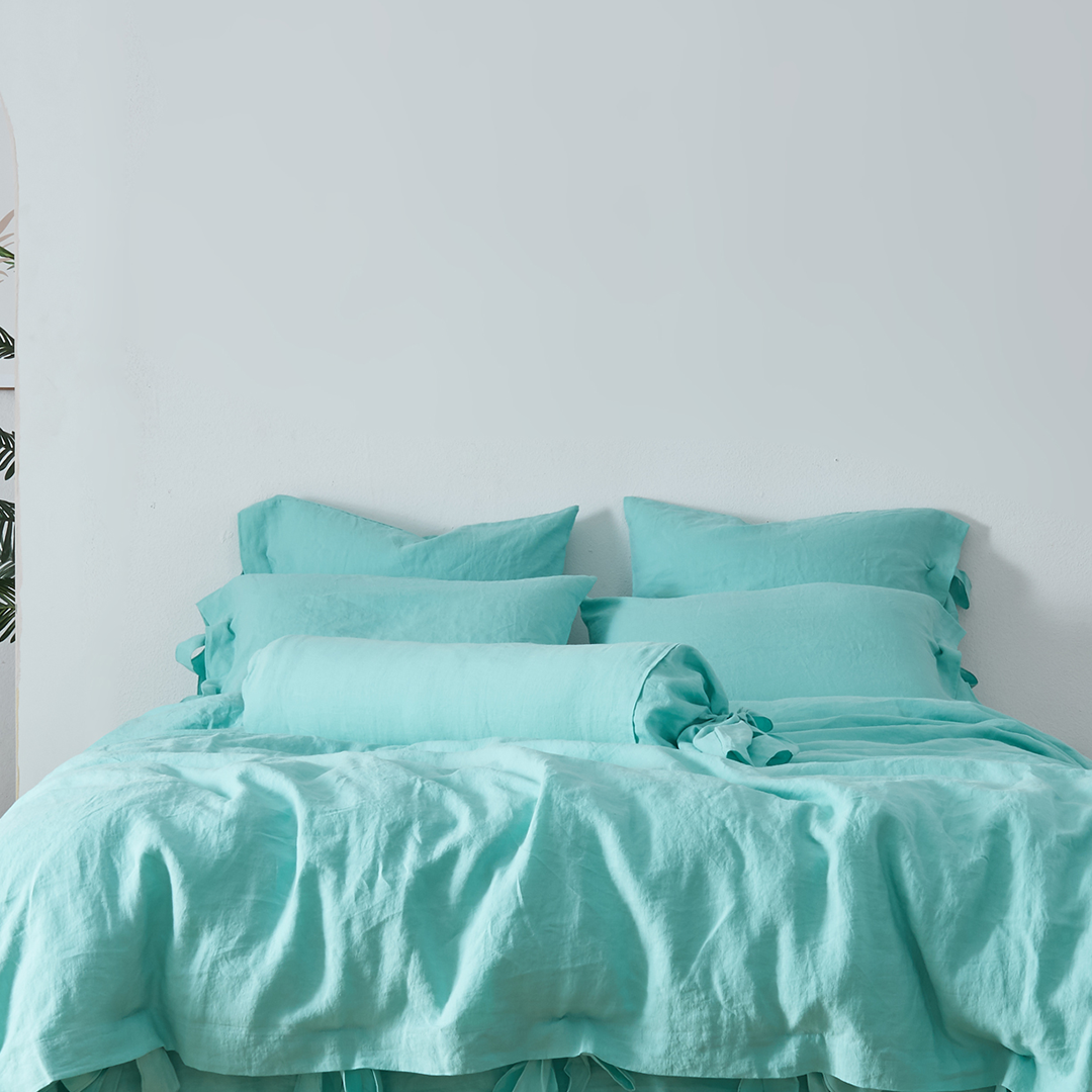 Aqua Green Linen Bow Ties Bolster Pillow on Bed