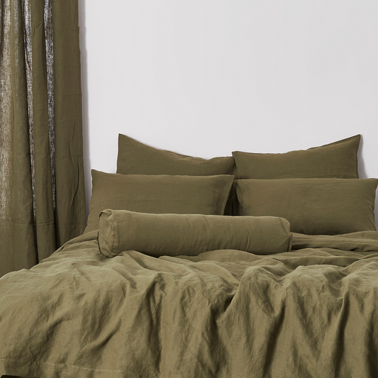 Olive Green Buttoned Linen Bolster Cushion on Bed