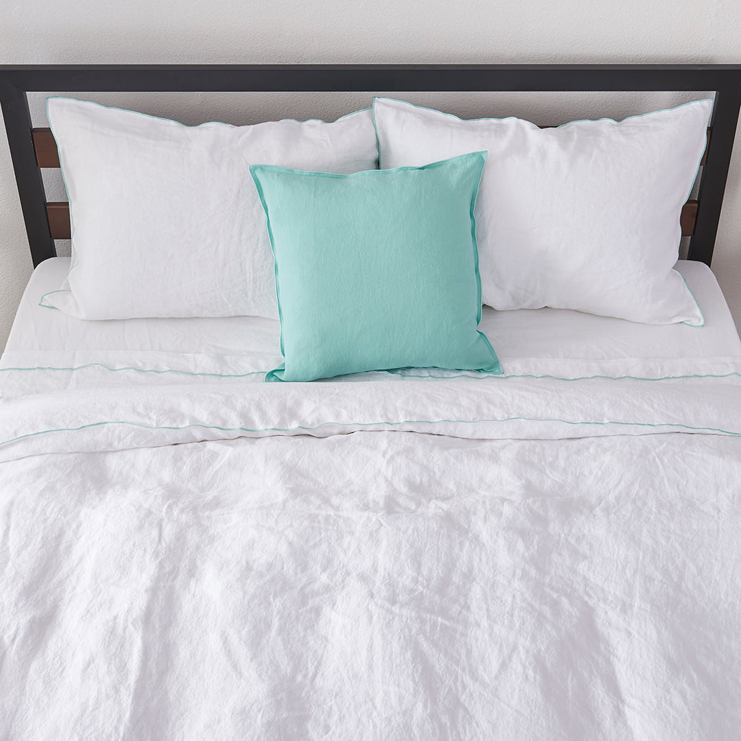 Bed with White Linen Aqua Embroidered Edge Duvet Cover