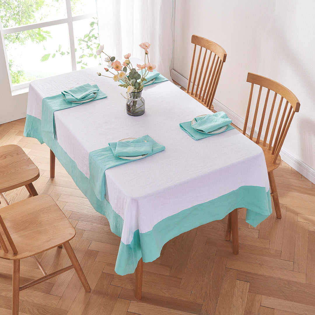 Aqua Green Color Bordered Linen Tablecloth on Table with Place Settings