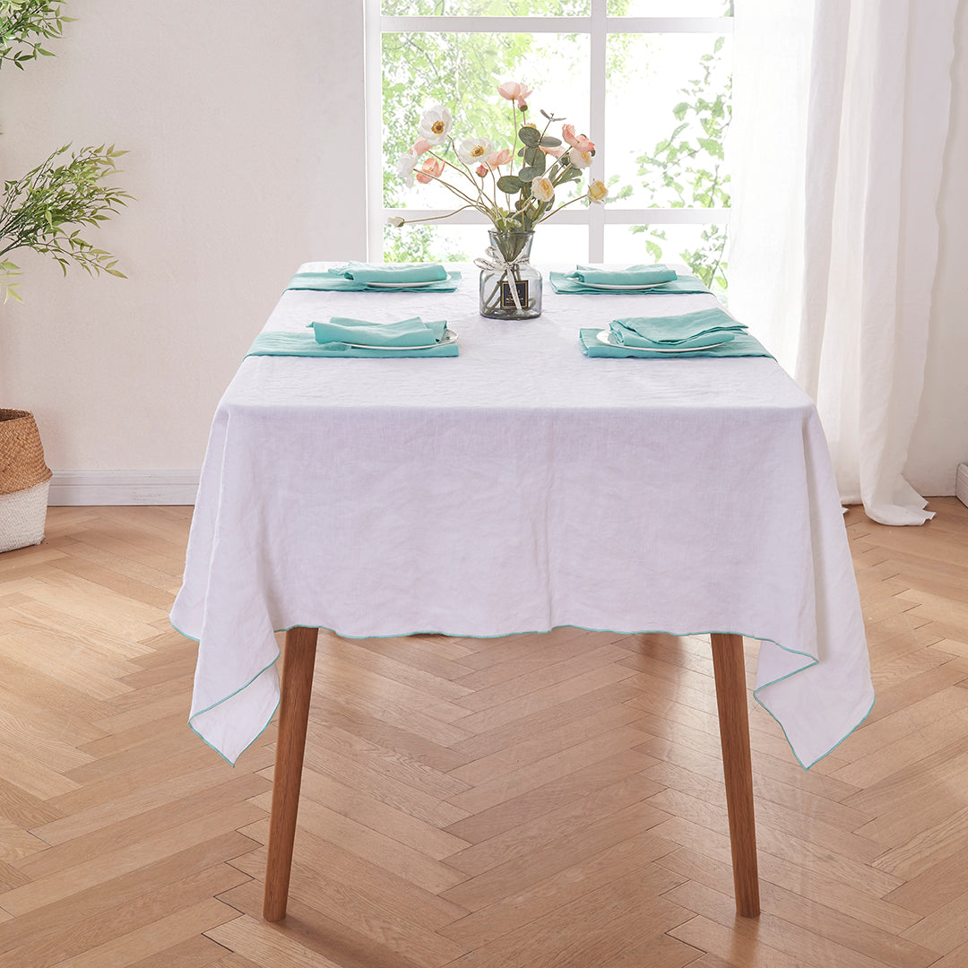 Aqua Green Edge Embroidered Linen Tablecloth on Table