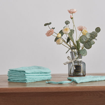 Stack of Aqua Green Plain Placemats on Table
