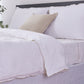 Beige Embroidered Edge of 100% Linen White Duvet Cover on Bed