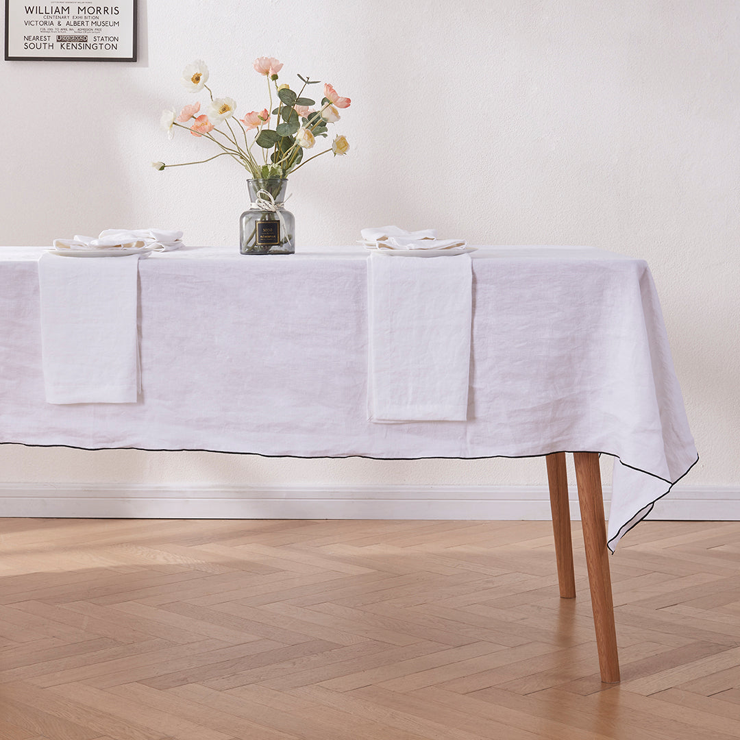 100% Linen White Tablecloth with Black Embroidered Edge on Table