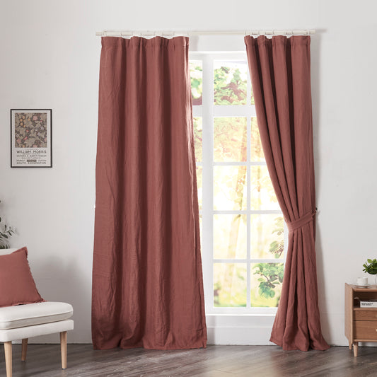 Rusk red linen drapery with blackout lining hanging over windows