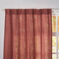 Close-up of the top of rusk red linen drapery
