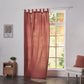 Rusk red linen drapery with tab tops billowing over windows