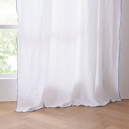 Hem Detail of White Linen Curtain with Brilliant Blue Embroidered Edge