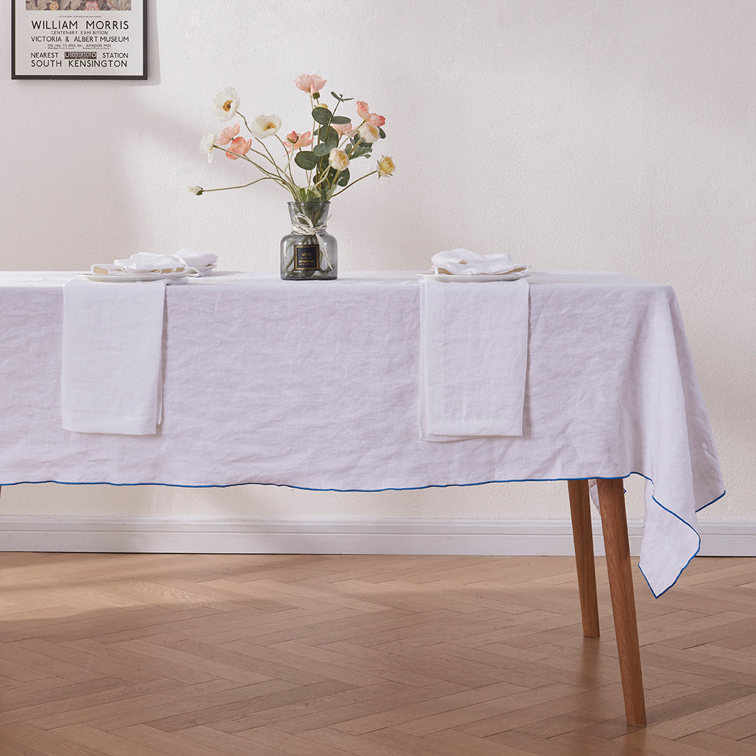 100% Linen White Tablecloth with Brilliant Blue Embroidered Edge on Table