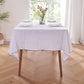 White Linen Tablecloth with Brilliant Blue Embroidered Edge on Dining Table