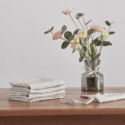 Stack of Cool Gray Linen Napkins on Dining Table