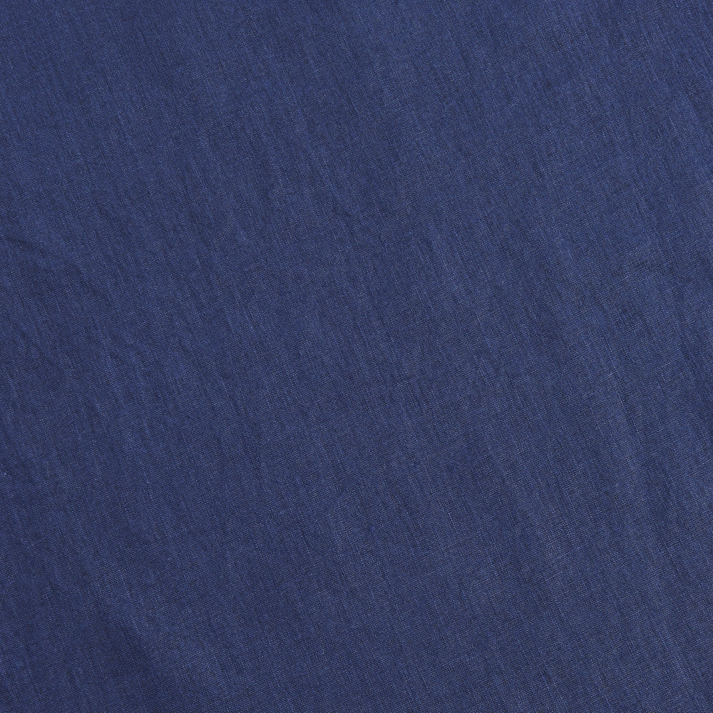 Close up of 100% linen fabric in indigo blue