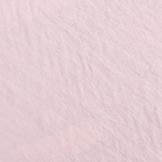 Close up of 100% linen fabric in peach