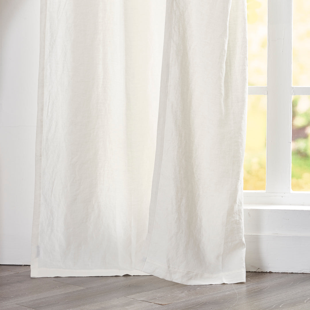 Hem of Ivory Linen Curtain on Window
