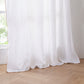 Hem of White Linen Curtain with Mustard Yellow Embroidered Edge on Window