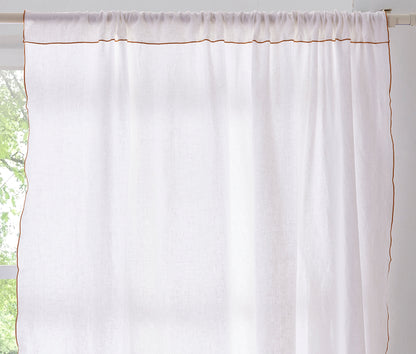 Detail of White Linen Curtain with Mustard Yellow Embroidered Edge on Window