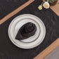 Plain Black Linen Napkin Folded on Plate