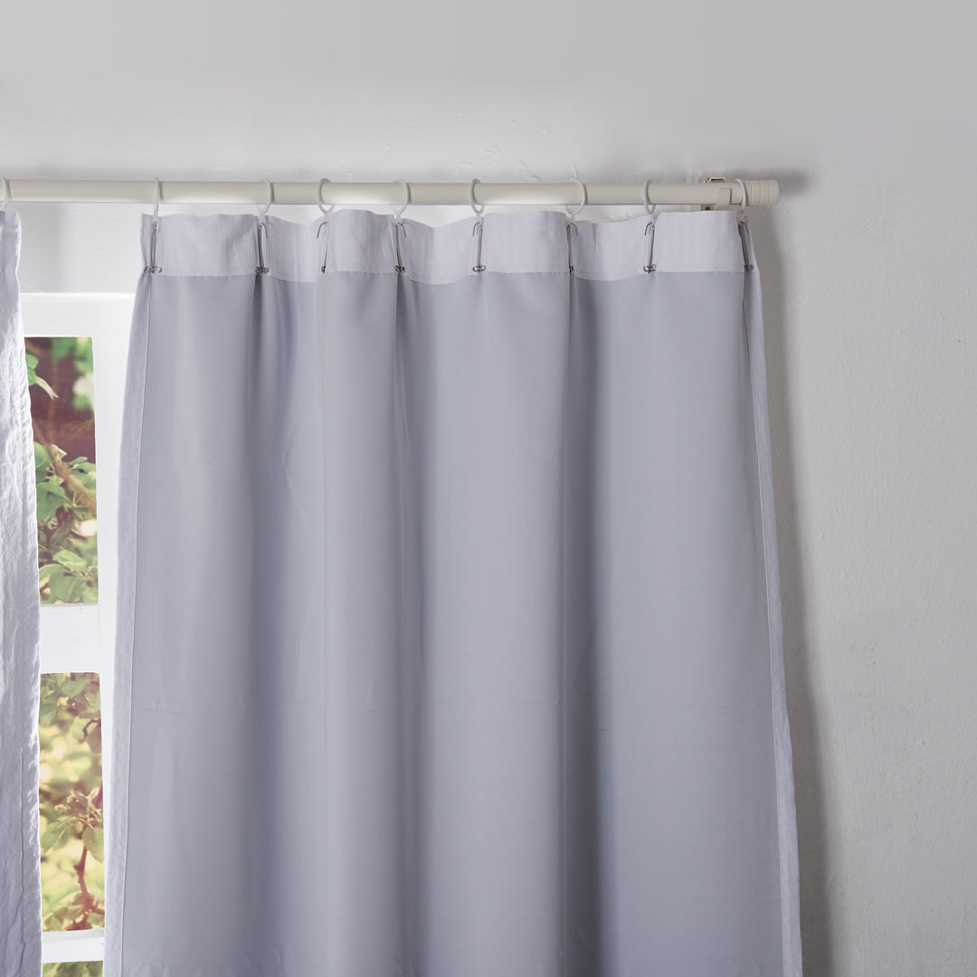 Back details of optic white curtains with blackout lining