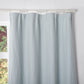 Close-up of the top of pale blue linen drapery
