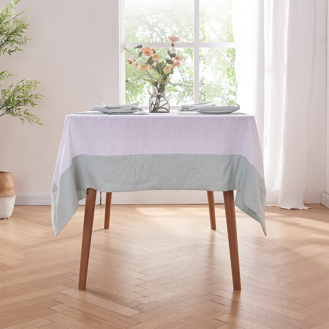 Pale Blue Bordered White Linen Tablecloth on Table