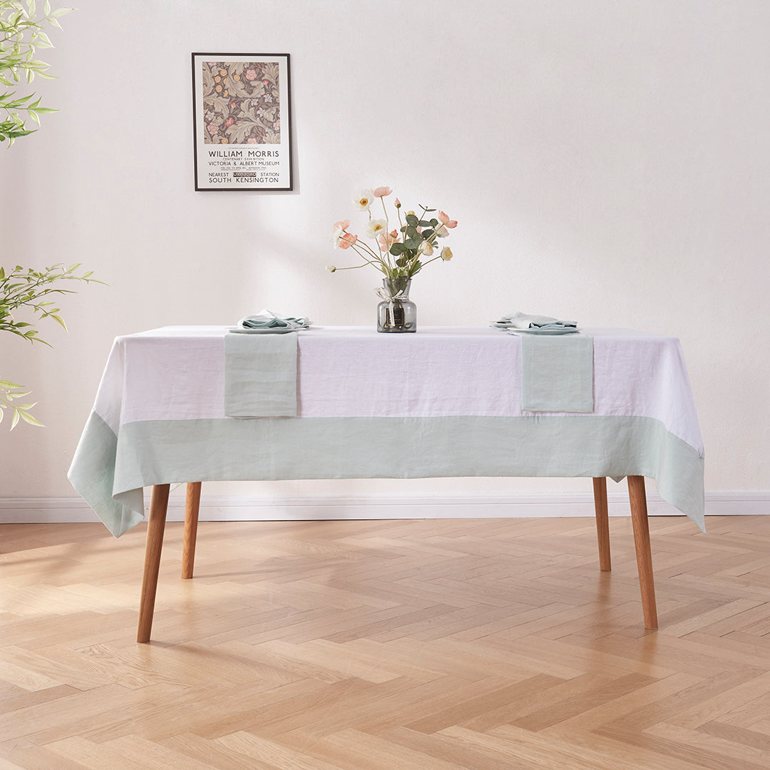 Dining Table with White Linen Tablecloth with Pale Blue Border
