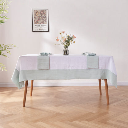Dining Table with White Linen Tablecloth with Pale Blue Border