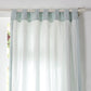 Close-up of back details of pale blue linen curtains with cotton lining