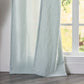 Close-up of 100% linen pale blue curtain hems