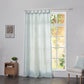 Pale blue linen drapery with tab tops hanging over windows