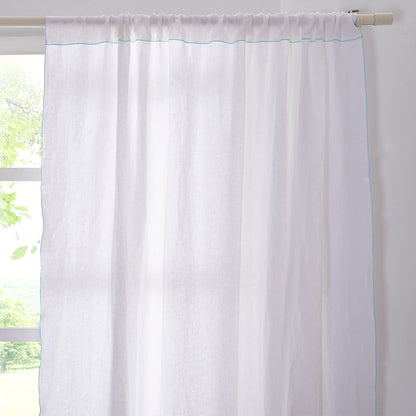 Top of White Linen Curtain with Pale Blue Embroidered Edge