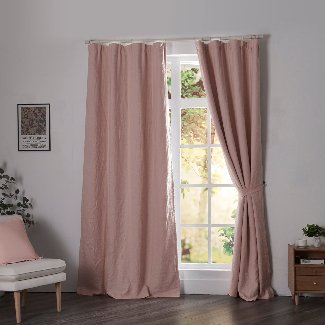 Peach linen drapery with blackout lining hanging over windows