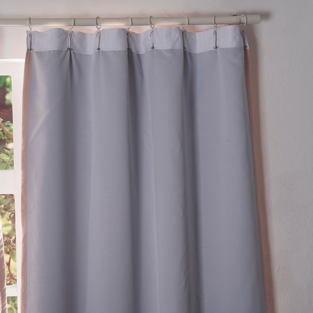 Back details of peach curtains with blackout lining