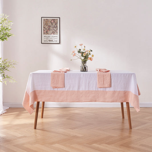 Side angle of 100% linen peach color bordered tablecloth