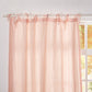 Close-up of the top of peach linen drapery