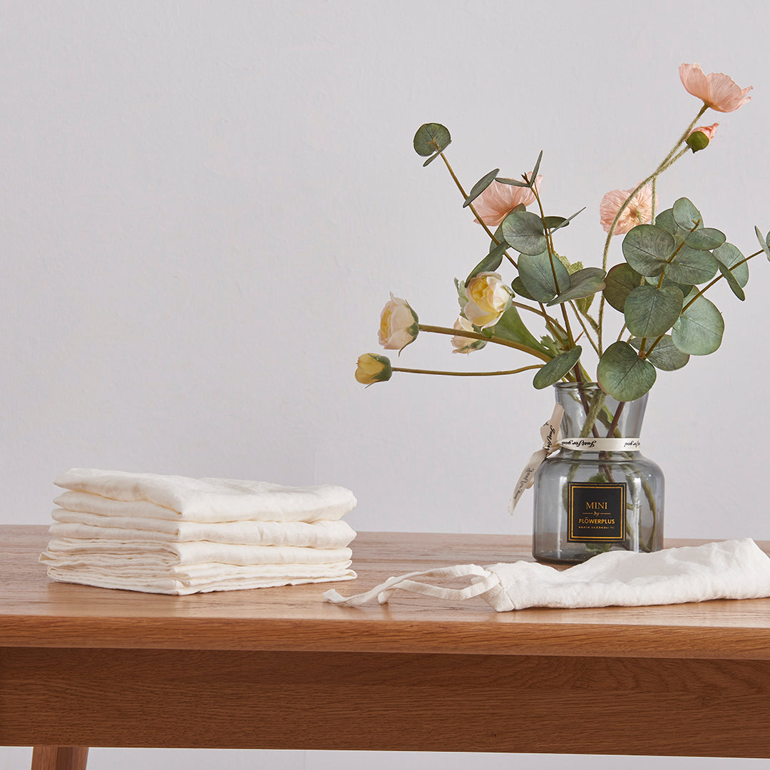 Stack of Ivory Linen Placemats on Table