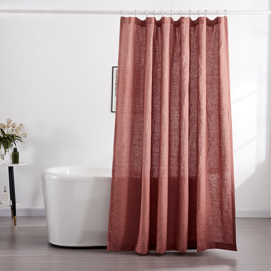 100% linen rust red shower curtain hanging over ceramic tub