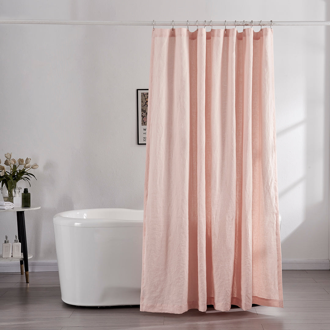 100% linen peach shower curtain hanging over ceramic tub