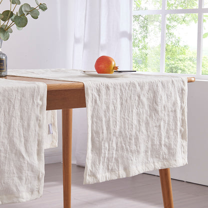 Ivory Linen Table Runners Draped Across Table