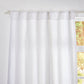 Close-up of the top of optic white linen drapery