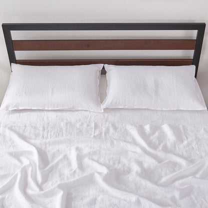 White Linen Flat Sheet with Embroidered Edge on Bed