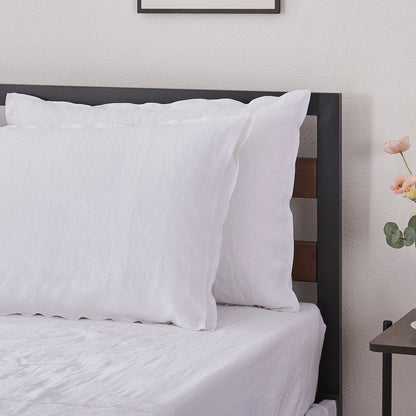 White Linen Pillowcases with Embroidered Edge on Bed