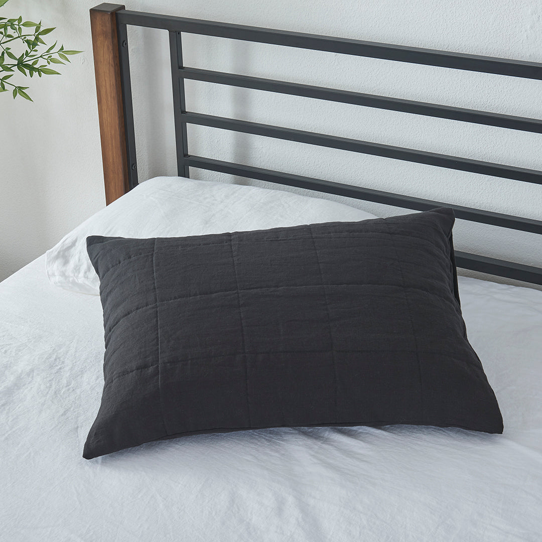 100% Linen Black Quilted Pillow Sham on Bed