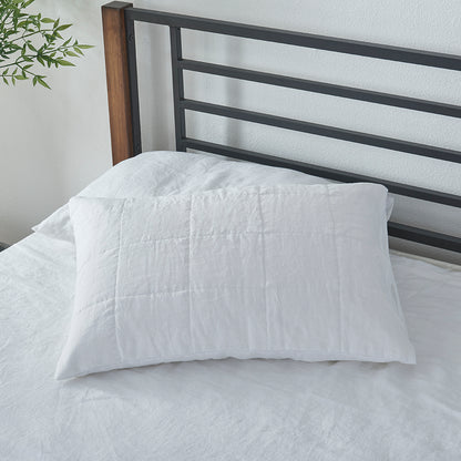 Optic White Linen Quilted Pillow Sham on Bed